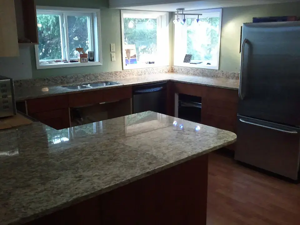 Kitchen with polished granite countertops