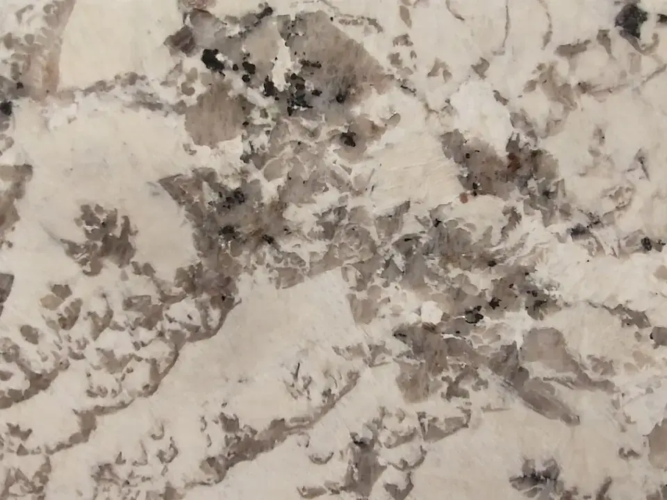 Light granite slab with grey and brown grain